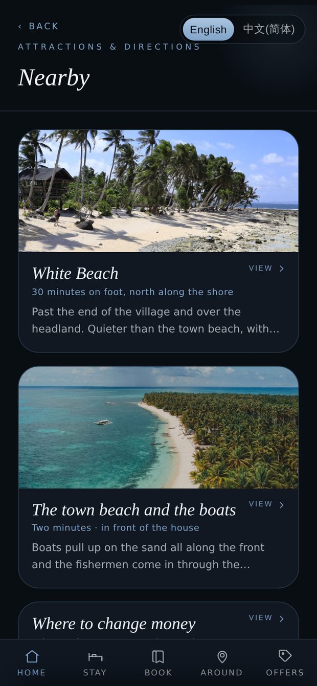The Nearby section of the guest app, headed Attractions and directions: White Beach, thirty minutes on foot north along the shore, past the end of the village and over the headland; the town beach and the boats, two minutes, in front of the house; and where to change money — each with a photograph.