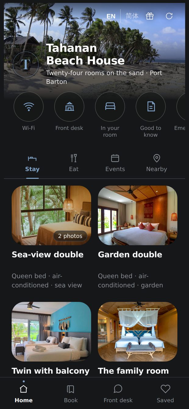 A guest’s home screen in the app, showing what the owner has put up: under What’s on, live music on the deck on Friday from 7pm with no cover, and the sunset paddle out on Tuesdays and Thursdays; under Yours while you stay, a welcome drink on arrival; and under Book with us, the hotel’s own island hopping and snorkelling trips.